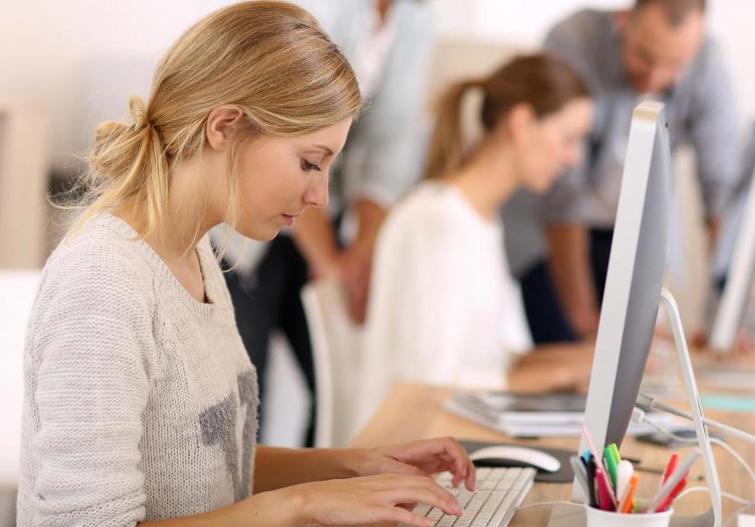 girl working on office computer